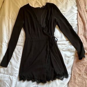 Forever 21 size small romper. Black with lace trim. Skort bottoms. Elegant.